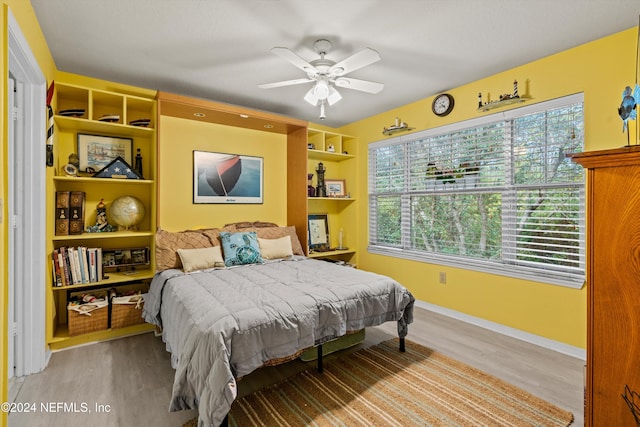 bedroom featuring ceiling fan and light hardwood / wood-style floors