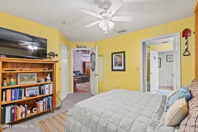 bedroom with ceiling fan and light wood-type flooring