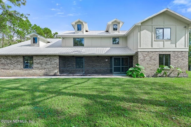 back of house featuring a yard