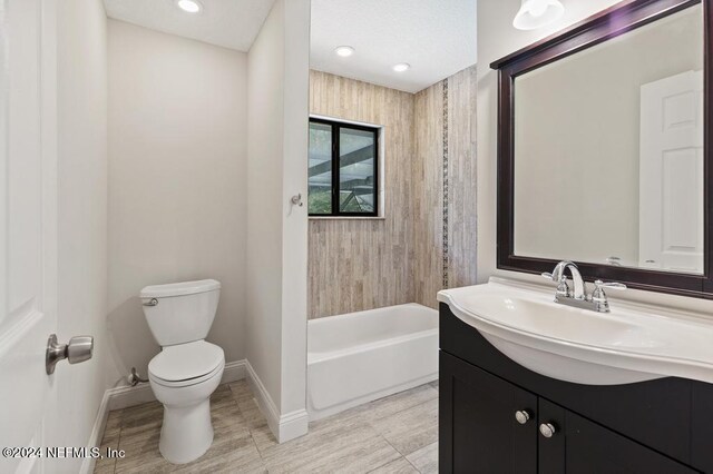 full bathroom featuring vanity, toilet, and shower / washtub combination