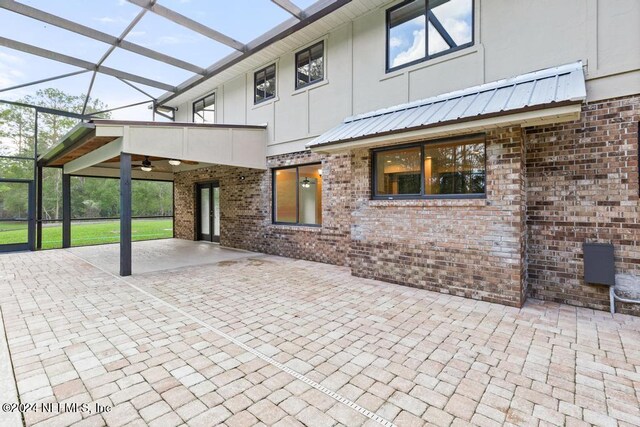 view of patio with a lanai and ceiling fan