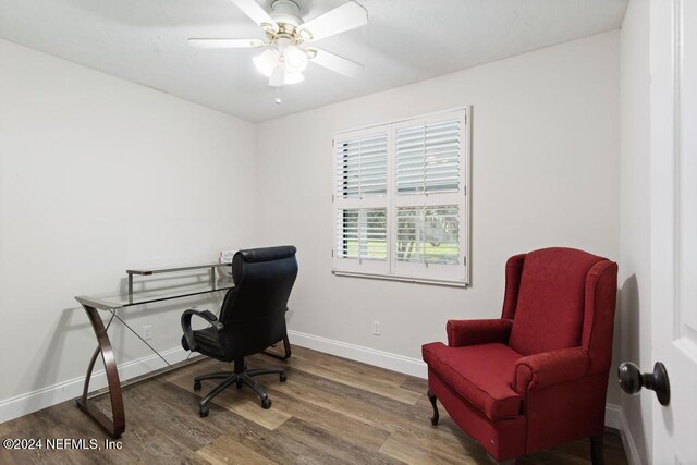 office space featuring wood-type flooring and ceiling fan