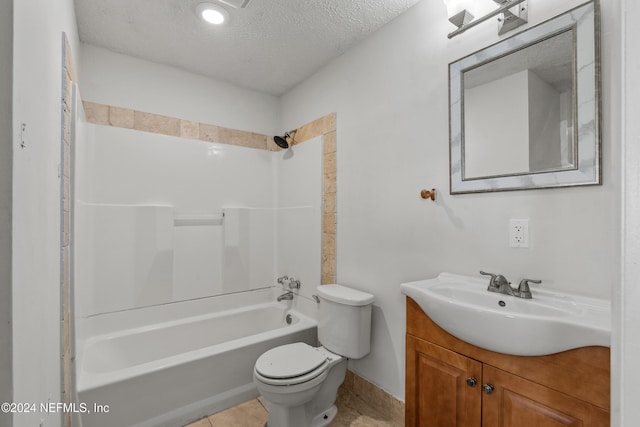 full bathroom featuring tile patterned flooring, bathing tub / shower combination, a textured ceiling, toilet, and vanity