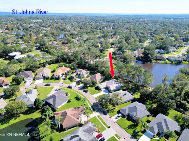 birds eye view of property with a water view