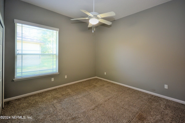 carpeted empty room with ceiling fan