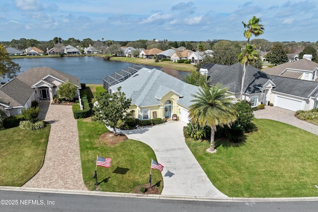 birds eye view of property featuring a water view