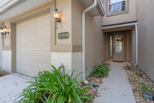 property entrance with a garage