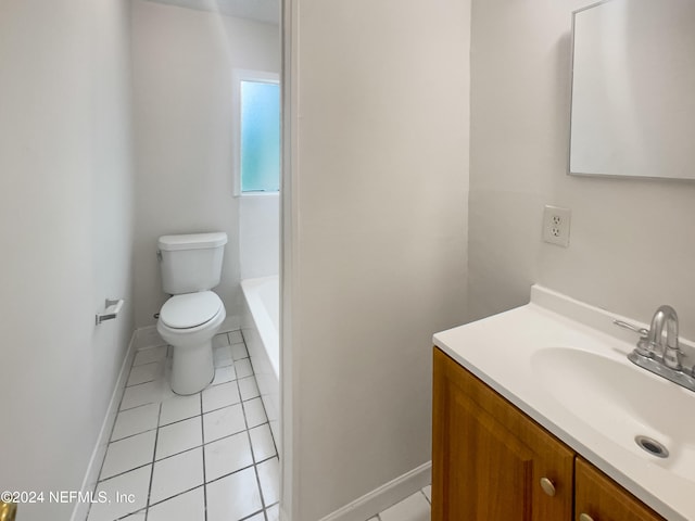 bathroom with a bath, tile patterned flooring, vanity, and toilet