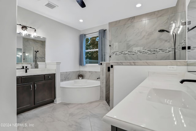 bathroom featuring independent shower and bath and vanity