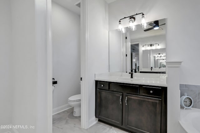 bathroom featuring vanity, toilet, and a bathtub