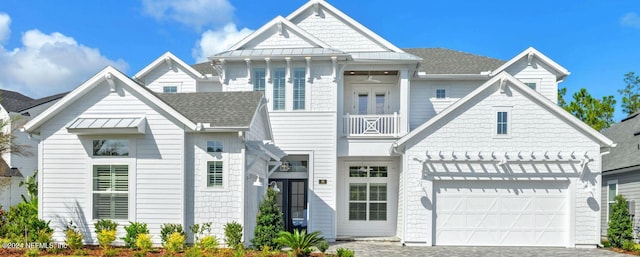 view of front of house with a balcony and a garage