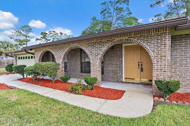 view of front of property featuring a garage and a porch