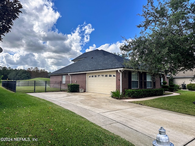 view of property exterior with a garage and a lawn