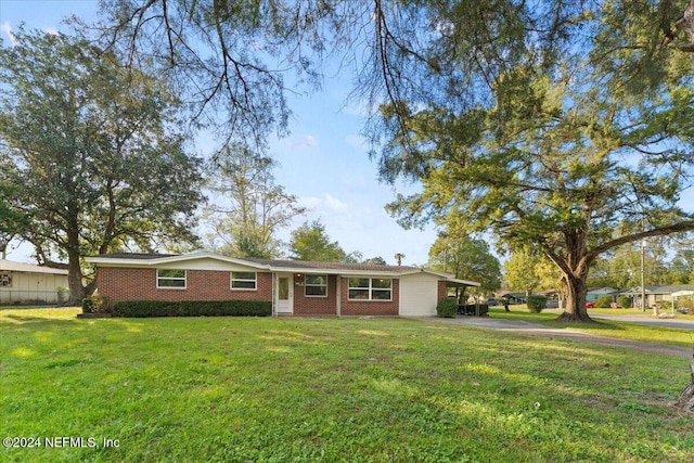 ranch-style home with a front yard and a carport