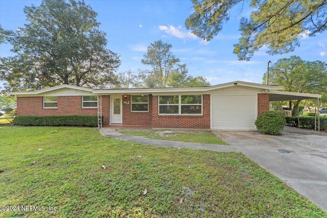 single story home featuring a front yard and a carport