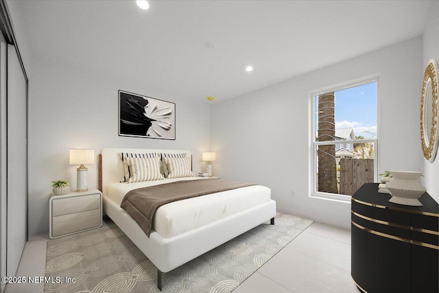 bedroom featuring light tile patterned floors