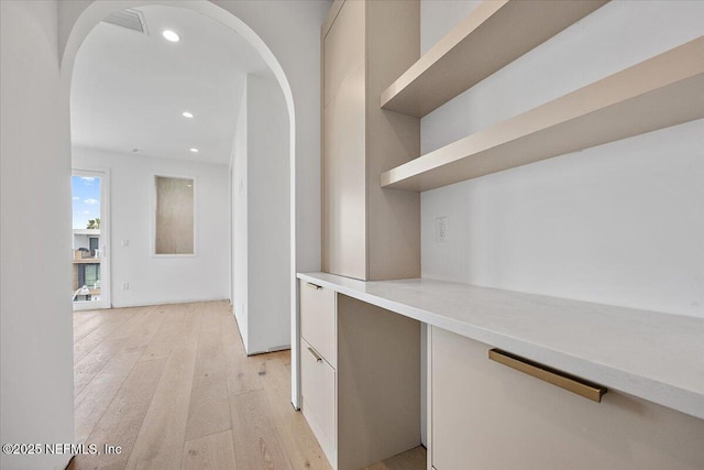 hallway with light wood-type flooring