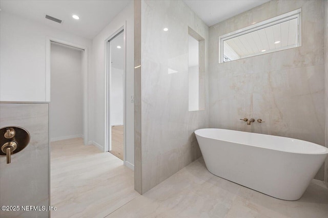 bathroom featuring a tub