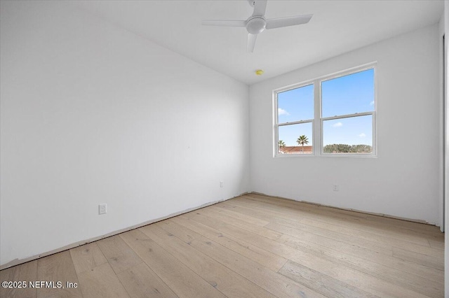 spare room featuring ceiling fan and light hardwood / wood-style floors