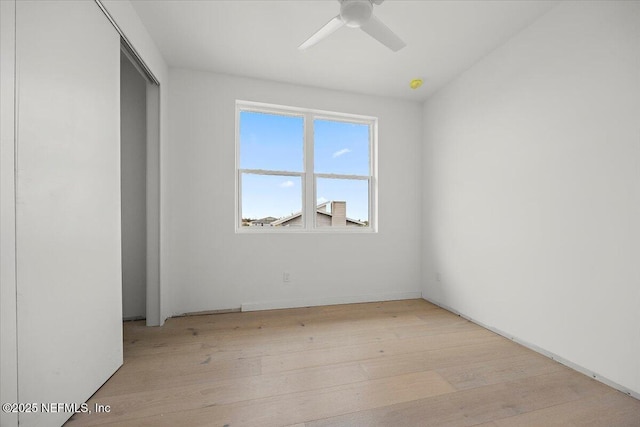 spare room featuring ceiling fan and light hardwood / wood-style floors