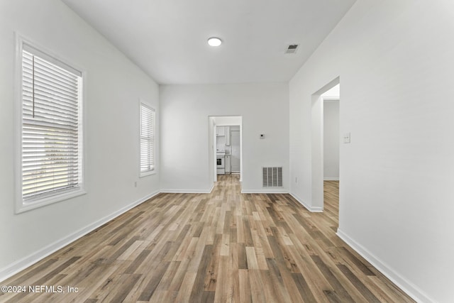 unfurnished living room with light hardwood / wood-style floors