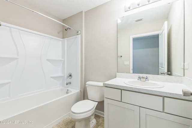 full bathroom with shower / tub combination, vanity, toilet, and a textured ceiling