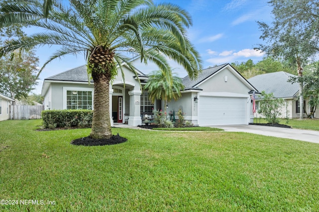 view of front facade with a garage and a front yard