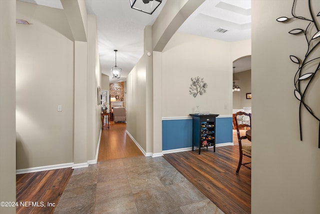 hall with hardwood / wood-style flooring