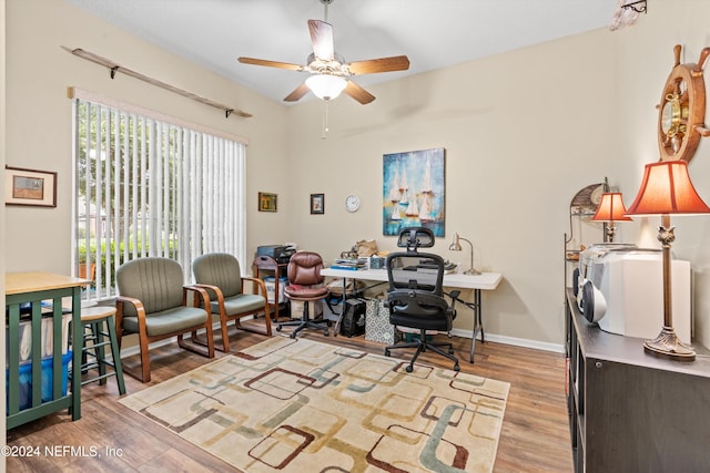 office space featuring light hardwood / wood-style floors and ceiling fan