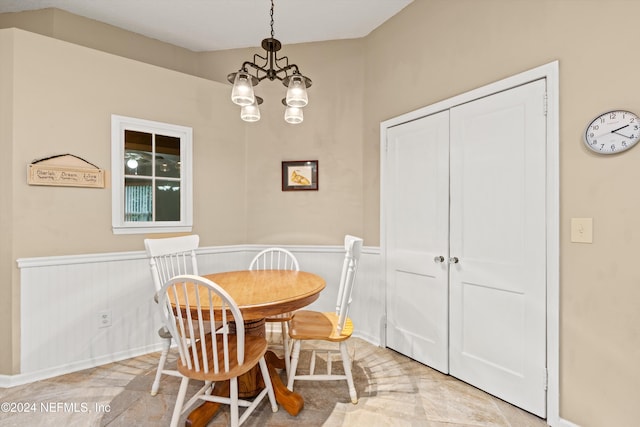 dining area with a notable chandelier