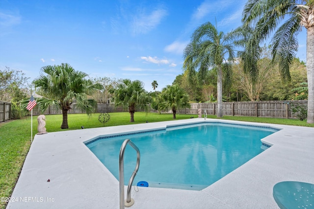 view of pool featuring a yard