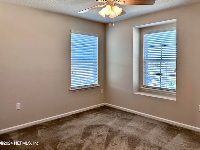 empty room featuring carpet flooring, a textured ceiling, and ceiling fan