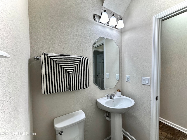 bathroom with sink and toilet