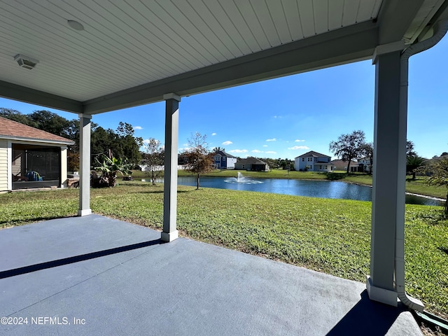 view of patio with a water view