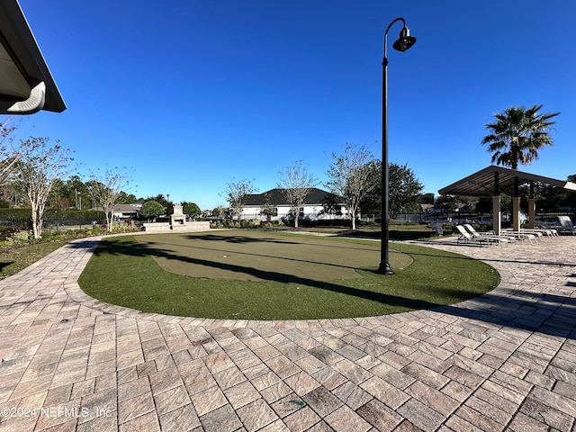 view of property's community with a patio