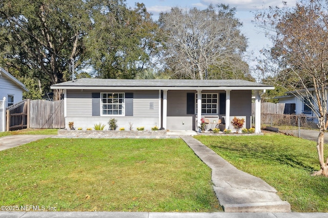 single story home with a front lawn and covered porch