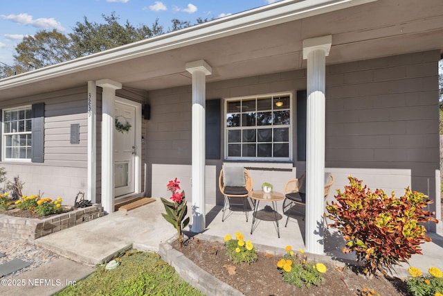 doorway to property with a porch