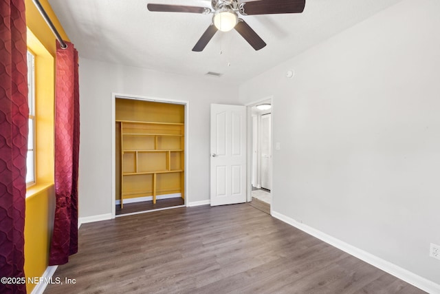 spare room with hardwood / wood-style floors and ceiling fan