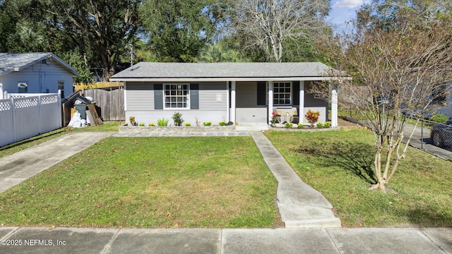 view of front of property with covered porch and a front yard