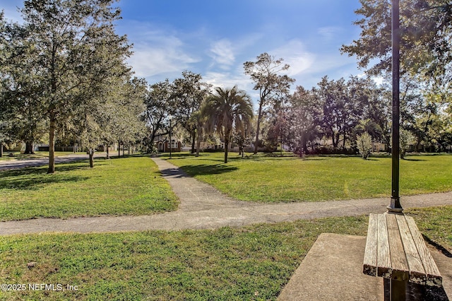 view of property's community featuring a yard