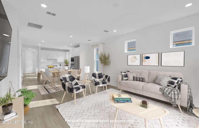 315 Fairlake Cir, Saint Augustine, FL 32092 - living room with light wood-type flooring, recessed lighting, and baseboards