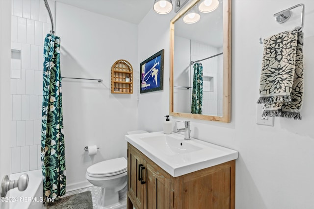 bathroom featuring walk in shower, vanity, and toilet