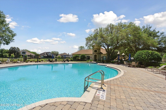 view of swimming pool featuring a patio