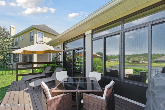 wooden deck with a water view