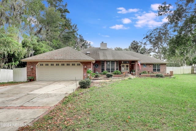 single story home with a garage and a front yard