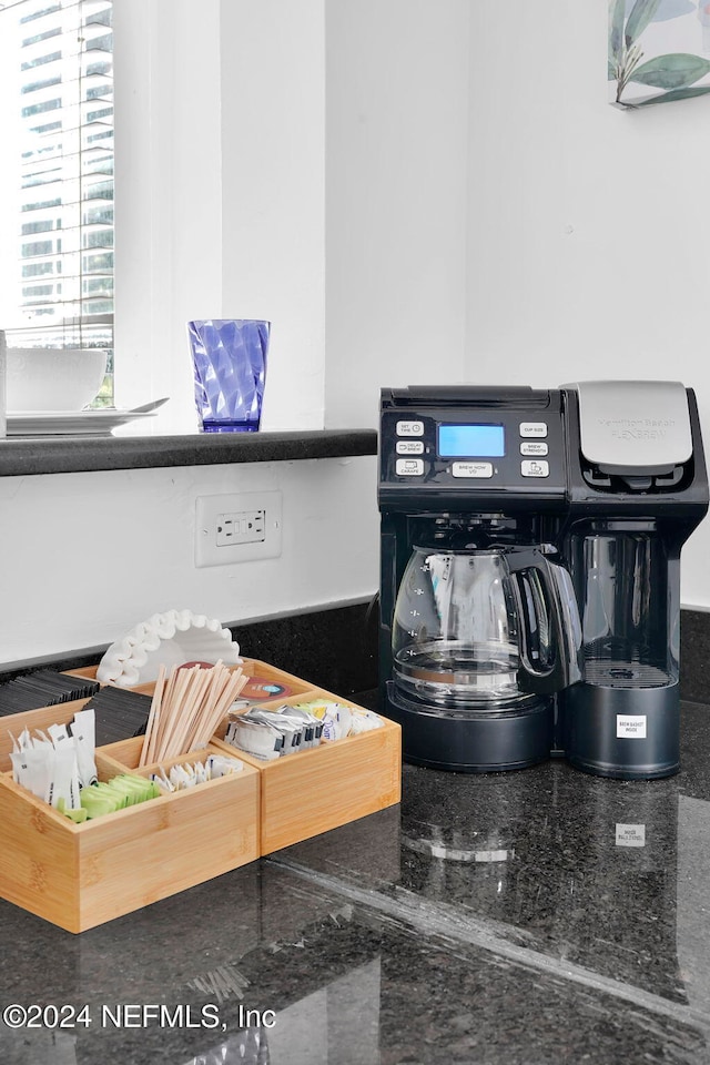 interior details featuring dark stone countertops