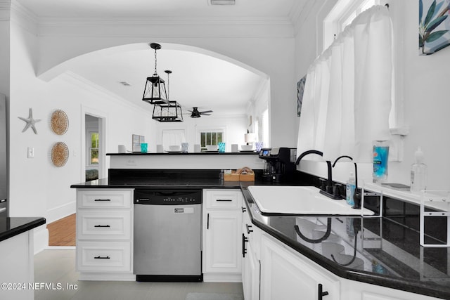 kitchen with decorative light fixtures, stainless steel dishwasher, sink, and white cabinets