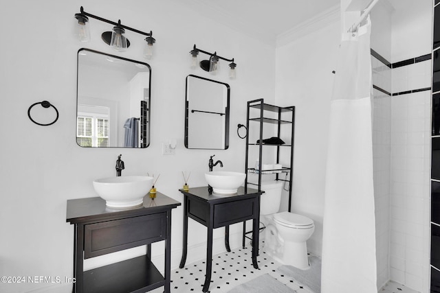 bathroom with ornamental molding, vanity, toilet, and a shower with curtain