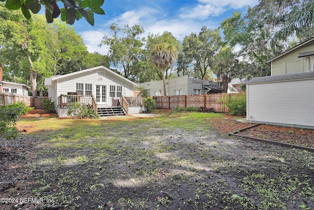 view of yard featuring a wooden deck