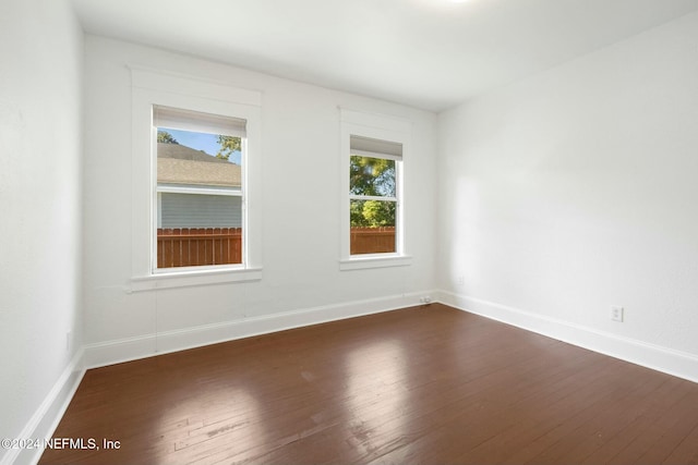 empty room featuring dark hardwood / wood-style floors